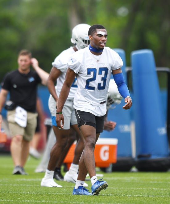 Lions cornerback Jeff Okudah, with a bandage on his forehead, during practice.