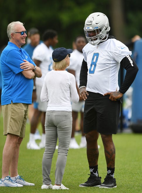 Lions president and CEO Rod Wood and principal owner and chairman Sheila Ford Hamp chat with linebacker Jamie Collins Sr. during a break in the action.