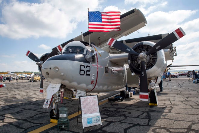 A Grumman C-1 Trader is pictured during Detroit’s Invitational Wings and Wheels classic car and aircraft show at Willow Run Airport in Ypsilanti, Michigan, on June 13, 2021. (Nic Antaya, Special to The Detroit News)