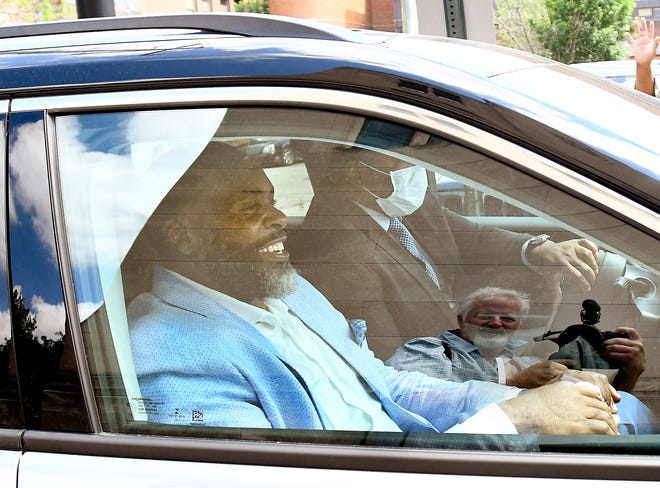 Former Detroit Mayor Kwame Kilpatrick leaves, still smiling and waving, after preaching at Historic Little Rock Baptist Church in Detroit, Michigan, on June 13, 2021.