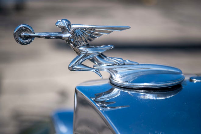 A 1933 Packard Super 8 Club Sedan is pictured during Detroit’s Invitational Wings and Wheels classic car and aircraft show at Willow Run Airport in Ypsilanti, Mich. on June 13, 2021.