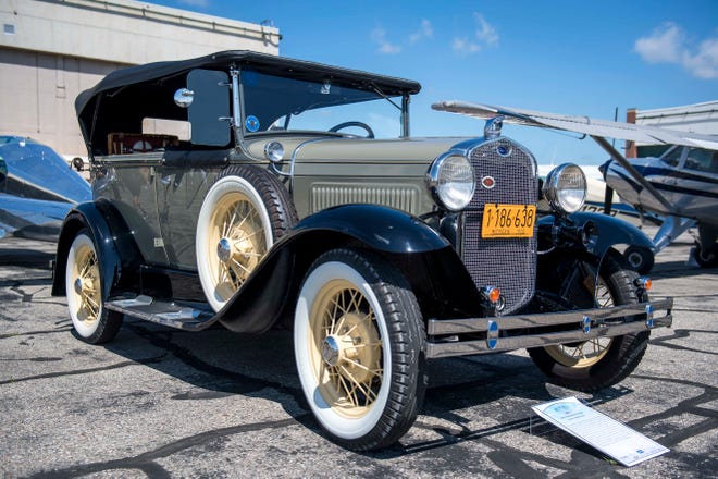 A 1930 Ford Model A Phaeton is pictured during Detroit’s Invitational Wings and Wheels classic car and aircraft show at Willow Run Airport in Ypsilanti, Mich. on June 13, 2021.