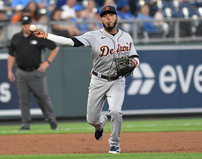 Tiger third baseman Harold Castro throws out Kansas City Royals' Hunter Dozier at first base during the fourth inning.