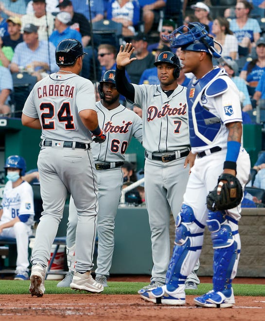 Tiger Miguel Cabrera (24) is congratulated by teammages Akil Baddoo (60) and Jonathan Schoop (7) after scoring during the 1st inning.