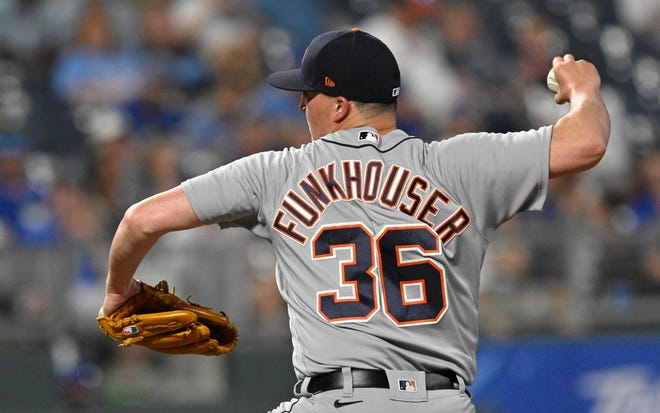 Tiger relief pitcher Kyle Funkhouser throws to a Kansas City batter during the fifth inning.