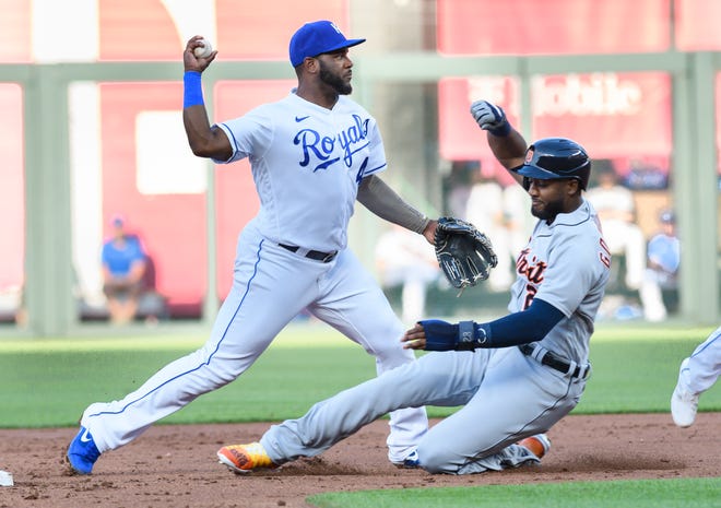 Tiger Niko Goodrum, right, is forced out at second base by Royals' Hanser Alberto for the first half of a double play during the first inning.
