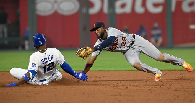 Royals' Jorge Soler, left, slides safely into second past the tag by Detroit Tigers shortstop Niko Goodrum for a double during the fifth inning.