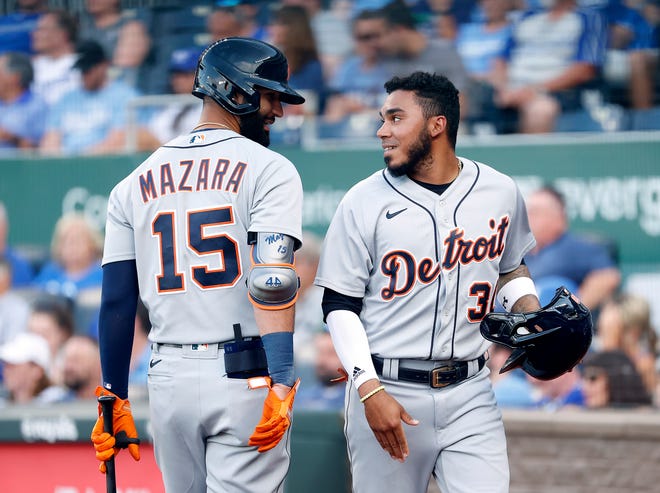 Tiger Harold Castro (30) is congratulated by teammate Nomar Mazara (15) after scoring during the 1st inning.