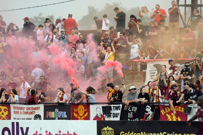Detroit City FC fans set off various colored smoke bombs after the start of last weekend's match against Chattanooga FC at Keyworth Stadium in Hamtramck.