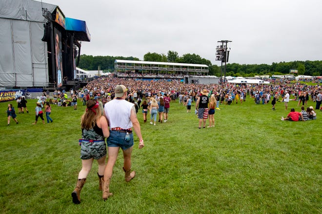 Fans walk towards the main stage during the country singer Carly Pearce performance at the Faster Horses music festival on July 16, 2021 in Brooklyn.