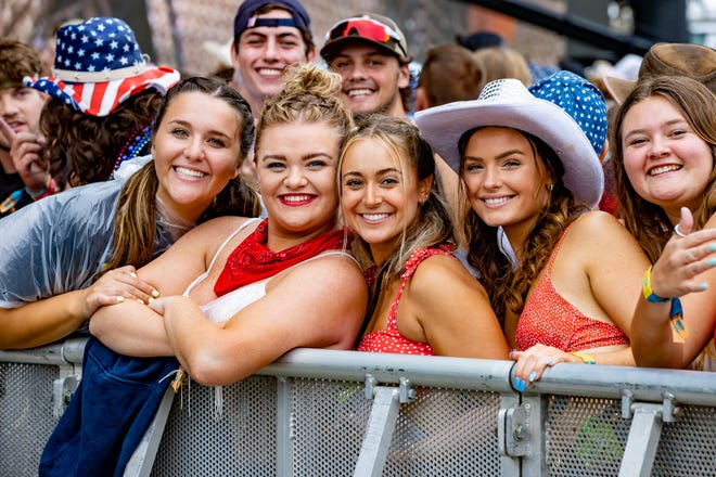 Fans pose for a picture before the country singer Carly Pearce performance at the Faster Horses music festival on July 16, 2021, in Brooklyn.