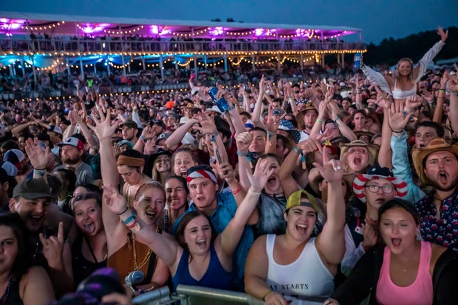 Luke Combs fans listen to his performance during the Faster Horses music festival on July 16, 2021, in Brooklyn.