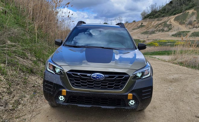 Back in black. The 2022 Subaru Outback Wilderness gets lots of back cladding like a new front fascia and hood decal.