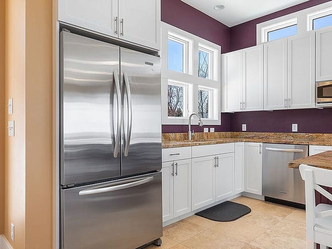 Gourmet kitchen with granite island, two dishwashers, and Dacor range.  Main floor laundry and second laundry with a washer and two dryers in fully finished basement.