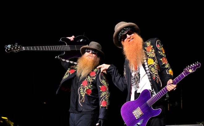 ZZ Top bassist Dusty Hill, left, and guitarist Billy Gibbons perform at DTE in Clarkston, opening for Kid Rock on Tuesday, August 20, 2013.