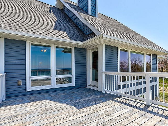 Spectacular Lake Michigan, custom-built home with over 80 ft. of frontage and built with family comfort and entertainment in mind.   Inviting gathering places, timeless design with 10 foot ceilings and open floor plan. Private access to extremely  private beach.