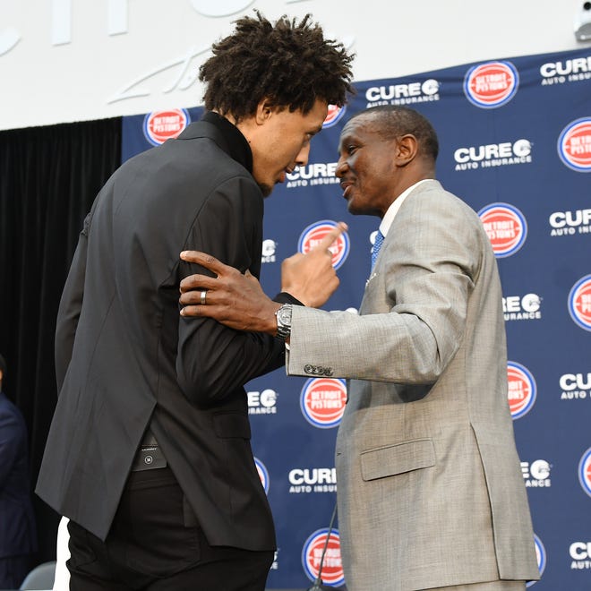 Cade Cunningham and Pistons head coach Dwane Casey share a moment at the end of the press conference.