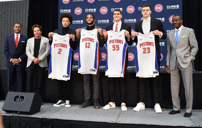 New Pistons Cade Cunningham, Isaiah Livers, Luka Garza and Balsa Koprivica hold their new jerseys with Troy Weaver, General Manager, Tom Gores, owner and Dwane Casey, head coach at the end of the Pistons introductory press conference of new players at Pistons Practice Center, July 30, 2021, Detroit, Mi.