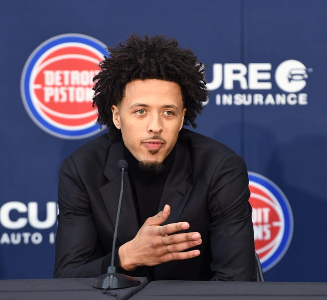 Cade Cunningham answers questions from reporters during the Pistons introductory press conference.