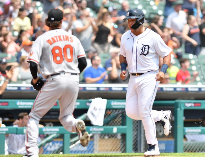 The Tigers' Miguel Cabrera scores on a double by Eric Haase in the first inning.