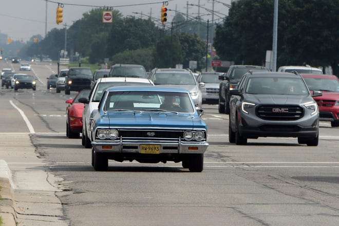 A cruiser driving a 1966 Chevelle heads southbound along Gratiot Avenue during the 18th annual Clinton Township Gratiot Cruise, Sunday, Aug. 1, 2021 in Clinton Township, Mich.
