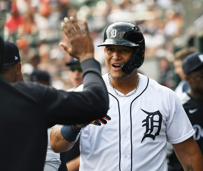 Tigers designated hitter Miguel Cabrera is congratulated in the dugout in the seventh inning he after he drew a walk and then was pinch run for.
