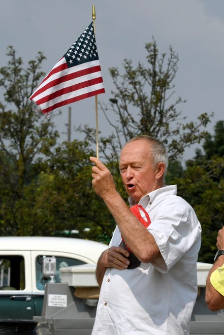 To officially kick off the Gratiot Cruise, the Pledge of Allegiance and Star Spangled Banner was recited during an openring ceremony, including Charlie Caldwell of Painesville, OH, at the 18th annual Clinton Township Gratiot Cruise, Sunday, Aug. 1, 2021 in Clinton Township, Mich.