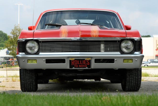 A 1970 Nova, belonging to Rollie Fillmore of Fraser, sits in a lot along Gratiot near 15 Mile. before the start of the Clinton Township Gratiot Cruise, Sunday, Aug. 1, 2021 in Clinton Township, Mich.