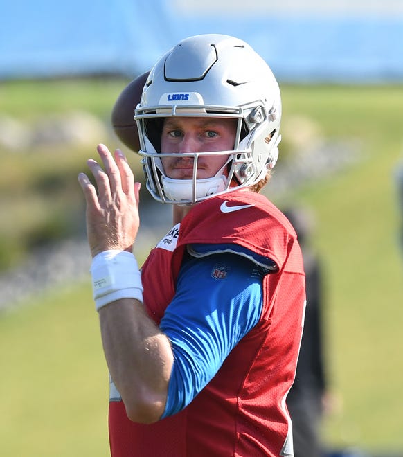 Lions quarterback Tim Boyle looks for his receiver during drills.
