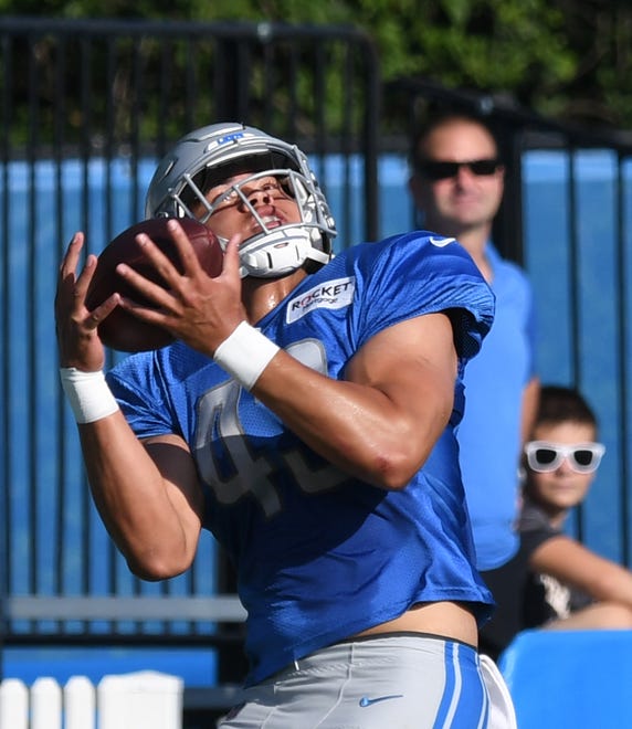 Lions tight end Charlie Taumoepeau pulls in a reception during drills.