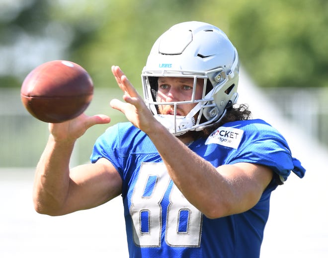 Lions tight end T.J. Hockenson readies for a reception at the end of practice.
