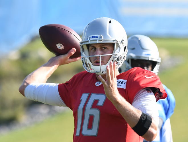 Lions quarterback Jared Goff looks for his receiver during drills.