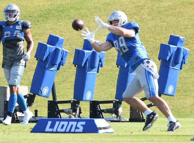 Lions tight end Jake Hausmann readies for a reception during drills.