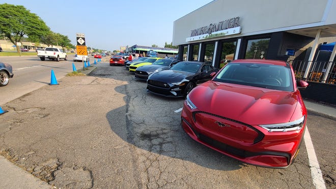 The 2021 Mustang Mach 1 has inspired the electric Mach E (foreground). They appeared together at Ford's Dream Cruise display in Royal Oak.