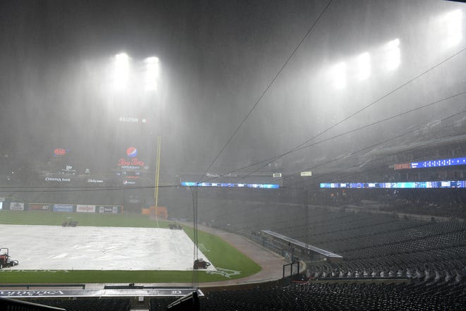 Lots of rain comes down during the weather delay after six innings of play.