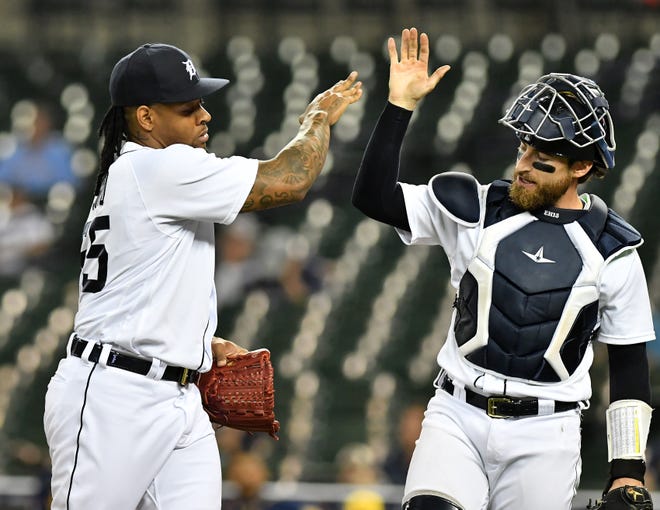 From left, Tigers pitcher Gregory Soto high fives catcher Eric Haase after the top of the tenth inning.