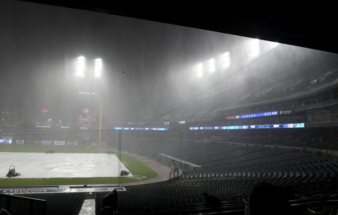 Lots of rain comes down during the weather delay after six innings of play.