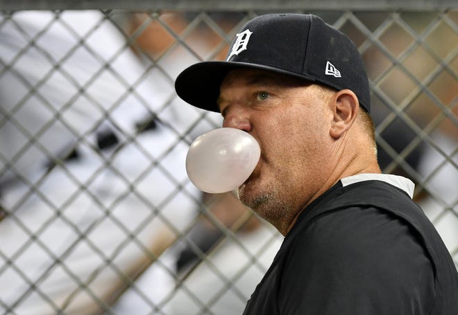 Tigers hitting coach Scott Coolbaugh blows a bubble in the sixth inning.