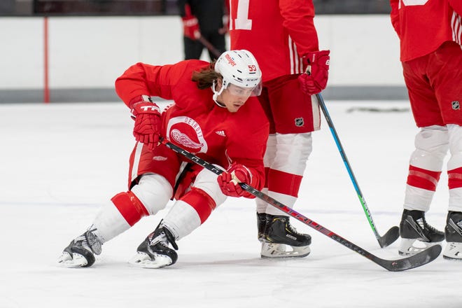 Left wing Tyler Bertuzzi skates the puck around his teammates during Red Wings training camp.