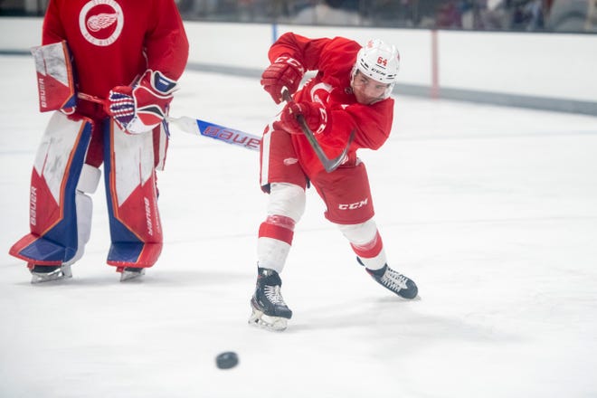 Left wing Luke Toporowski shoots the puck during Red Wings training camp.
