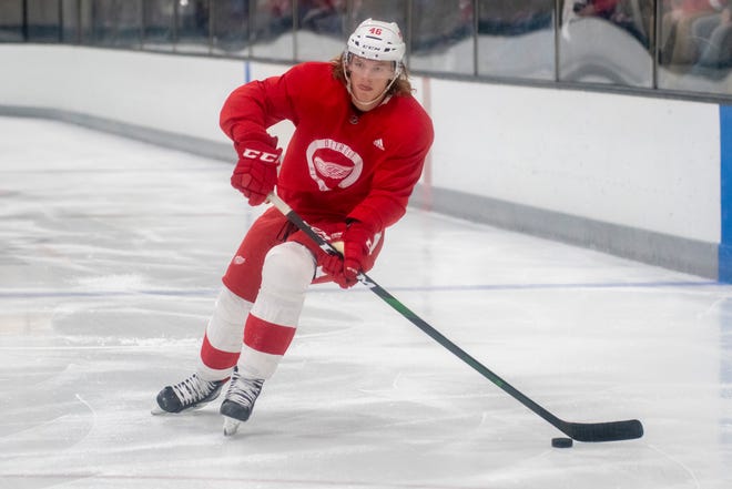 Center Chase Pearson looks to pass the puck during Red Wings training camp.
