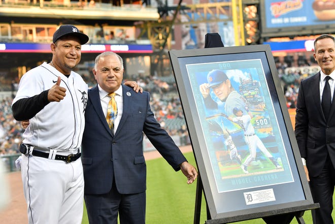 From left, Tigers Miguel Cabrera, Al Avila, Tigers Executive Vice President, Baseball Operations/General Manager and Chris Ilitch, president of Ilitch Holdings are pictured with artwork presented to Cabrera during a special pregame ceremony celebrating Miguel Cabrera and his journey to 500 home run.