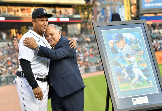 From left, Tigers' Miguel Cabrera and Al Avila, Tigers Executive Vice President, Baseball Operations/General Manager after Cabrera was given unique artwork, right, during a special pregame ceremony celebrating Miguel Cabrera and his journey to 500 home run.