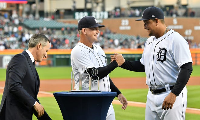 From left, Chris Ilitch, president of Ilitch Holdings and Tigers manager AJ Hinch present Miguel Cabrera with a crystal piece commemorating his 500 home runs during a special pregame ceremony celebrating Miguel Cabrera and his journey to 500 home run.