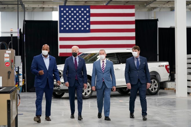 President Joe Biden tours the Ford Rouge EV Center, Tuesday, May 18, 2021, in Dearborn, Mich. From left, Corey Williams, plant manager, Biden, William "Bill" Ford, Jr., Executive Chairman, Ford Motor Company and Jim Farley, CEO, Ford Motor Company.