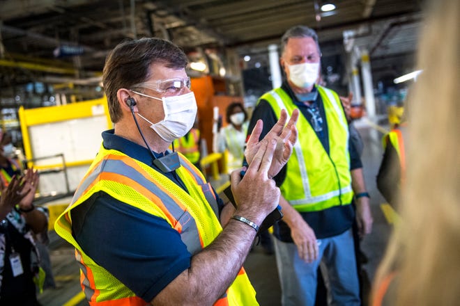 Ford's incoming CEO Jim Farley claps during a plant tour at the Ford Dearborn Truck Plant in Dearborn, Mich. on Sept. 25, 2020.