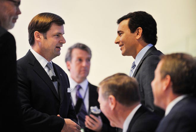 Ford executives Jim Farley (left), vice president of global marketing, sales and service and Lincoln, chats with Ford chief operating officer Mark Fields just before the Lincoln MKC Concept car unveiling on the first media day at the 2013 North American International Auto Show at Cobo Center in Detroit.  Photos taken on Monday, January 14, 2013.
