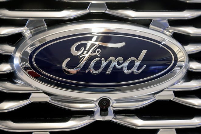 This Feb. 14, 2019 file photo shows the Ford logo on the front grill of a 2019 Ford Explorer on display at the 2019 Pittsburgh International Auto Show in Pittsburgh. On his first day in Fordâ€™s top job, new CEO Jim Farley is replacing the companyâ€™s chief financial officer and announcing other structural and management changes. The company says in a statement Thursday, Oct. 1, 2020,  that Chief Financial Officer Tim Stone is leaving Oct. 15 to be chief operating officer at a small artificial intelligence company.