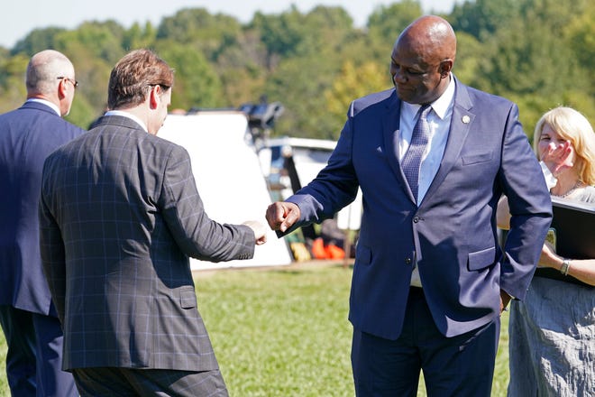 United Auto Workers President Ray Curry, right, bumps fists with Jim Farley, Ford president and CEO, left, after a presentation on the planned factory to build electric F-Series trucks and the batteries to power future electric Ford and Lincoln vehicles Tuesday, Sept. 28, 2021, in Memphis, Tenn. The plant in Tennessee is to be built near Stanton, Tenn.