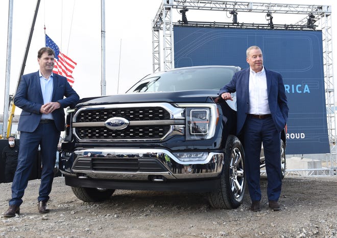 l-r, Jim Farley, COO of Ford Motor Co and Bill Ford, Jr. Executive Chairman of Ford Motor Co.poses with the new  F-150 after the event.**Ford unveils the new F-150 electric truck at the historic Dearborn Truck Plant in the Rouge complex. September 17, 2020, Dearborn, MI.